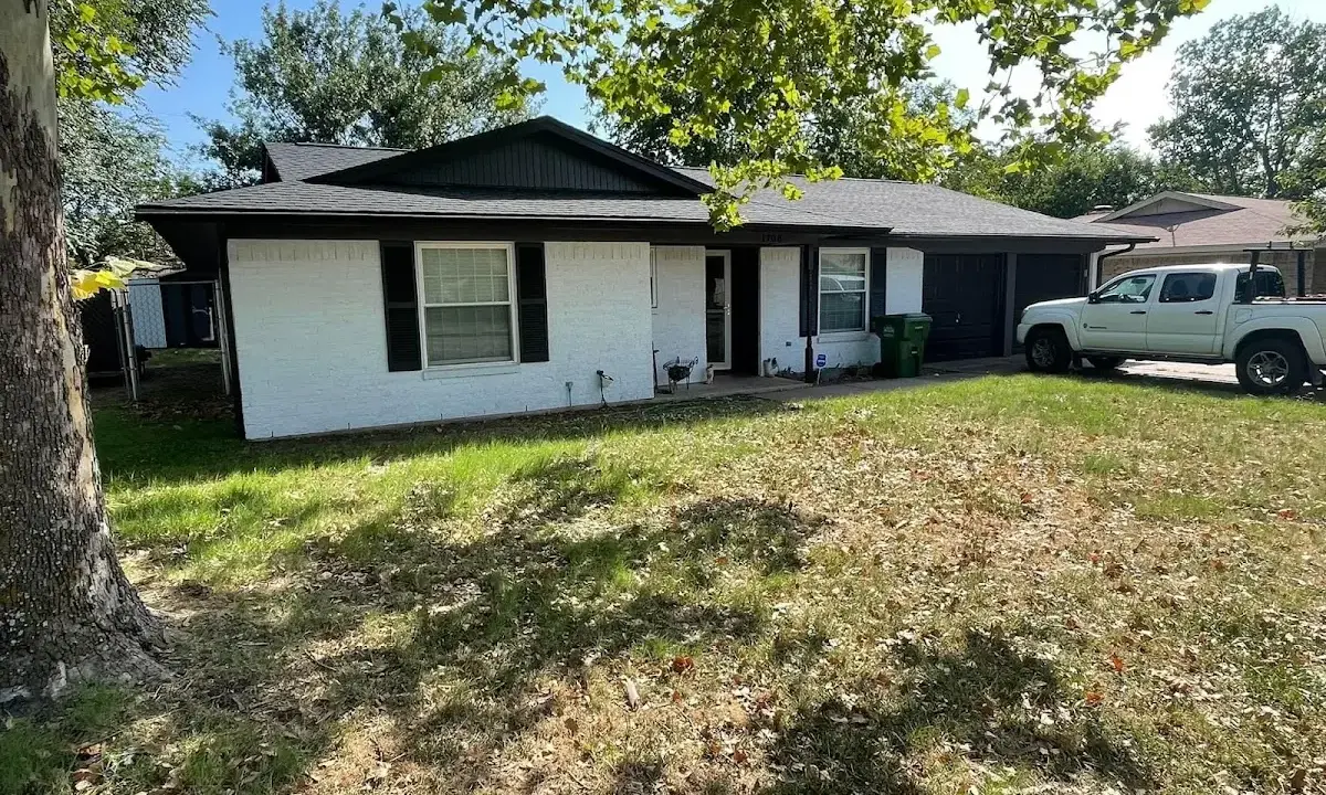 Professional roofing crew working on a residential roof in Westfield